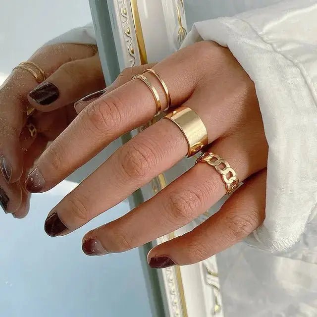 Elegant butterfly rings for women displayed on a hand with various stylish gold bands