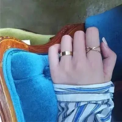 Elegant butterfly rings for women displayed on a hand with stylish striped sleeve